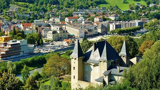 Castle overlooking a town and a lake