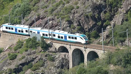 Train passing over a mountain viaduct